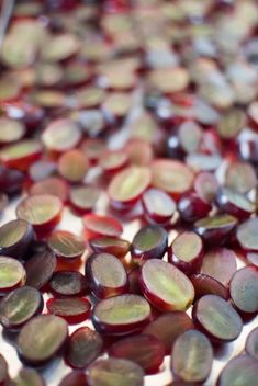 some red and yellow pieces of food on a white surface