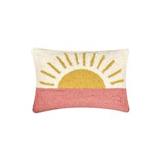 an embroidered pillow with the sun on it