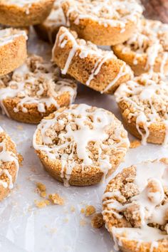 freshly baked cinnamon rolls with icing on a baking sheet, ready to be eaten