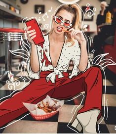 a woman sitting on the floor eating french fries and holding a cell phone in her hand