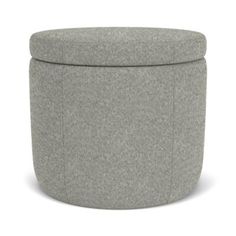 a grey ottoman with a round cover on it's legs and the lid is up