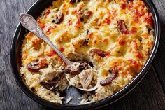 a casserole dish with chicken, rice and mushrooms