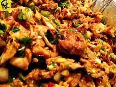 a large bowl filled with meat and vegetables