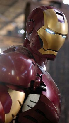 a close up of a iron man suit on display