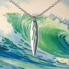 Intricately detailed surfboard necklace, adorned with a tidal flow design, reflects the ocean's essence. For men and women who cherish the sea, this necklace is a thoughtful gift, carrying the spirit of adventure and freedom. High quality strong stainless steel chain is included, choose your own length.  This is a larger style necklace best worn with longer chains, 24 inch + Surfboard pendant size : 4 x 1  cm Made in Australia with the finest lead-and-nickel-free pewter. Pewter is a naturally tarnish-resistant metal that has been used since Roman times to create everything from cutlery to items of beauty such as fine jewellery and ceremonial chalices. Oz Art Studios, originally beginning as Oz Pewter in 1993, has been making award-winning pewter for nearly 25 years. All items come with fre Necklace Boyfriend, Surfer Jewelry, Wave Beach, Beach Necklace, Beach Surfing, Flow Design, Beach Necklaces, Mens Necklace, Surf Board