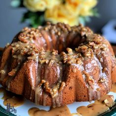 a bundt cake on a plate with caramel drizzle