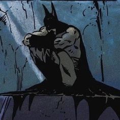 an image of a batman sitting in the rain