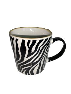 a black and white zebra print coffee cup