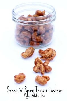 sweet'n spicy tamari cashews in a glass jar on a white background