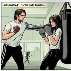 a man and woman boxing in a gym with one punching the other's hand