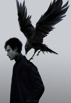 a man standing next to a black bird on his shoulder and another bird flying above him