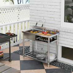 an outdoor grill with food on it in front of a white brick wall and black and white checkered flooring