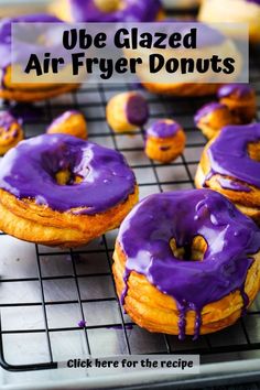 glazed air fryer donuts with purple icing on a cooling rack, ready to be eaten