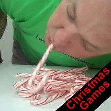 a man is blowing out candy canes on the table