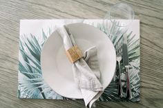 a place setting with napkins and silverware