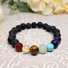 Make a special gift or treat yourself with this 7 Chakras bracelet! This healing crystal bracelet is a perfect gift for any occasion! It is a combination of genuine, high quality crystals, carefully selected so they can heal and strengthen the Chakras energies and protect the spirit. All bracelets have been cleaned with white Sage so they can arrive to you with their original energies!  PRODUCT HIGHLIGHTS ✨ made to order specially for you 💖 ✨ 3 crystals for triple energy effect ✨ perfect for gi Chakra Crystal Bracelet, 7 Chakra Bracelet, Chakra Stone Bracelet, Luxury Multi-stone Spiritual Bracelets, Blue Hand-strung Crystal Bracelet For Meditation, Vert Turquoise, Energy Bracelets, Purple Agate, Crystal Healing Bracelets