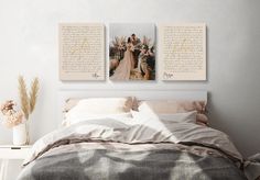 a bed with two pictures on the wall above it