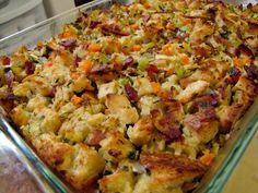 a casserole dish filled with stuffing and vegetables