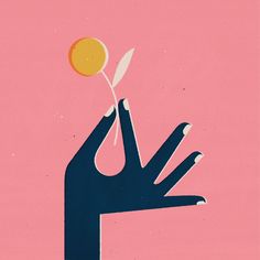 a person's hand holding a yellow ball in the middle of their palm, against a pink background