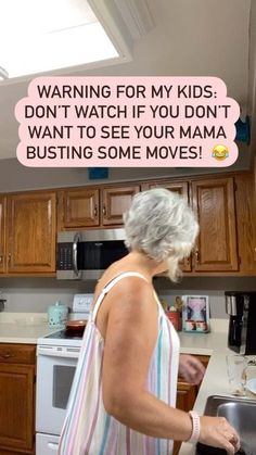 an older woman cooking in the kitchen with a joke on her face that reads, warning for my kids don't watch if you don't want to see your mama busting some moves