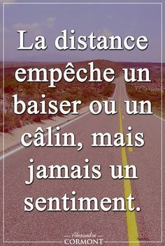 a road with the words la distance empeche un baiser oun calm, mais jamais un sentiment