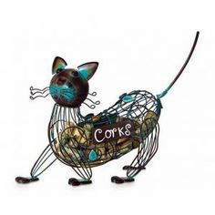 a metal cat figurine with corks on it's legs