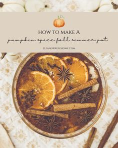 an overhead view of oranges and cinnamon sticks in a glass bowl with the title how to make a pumpkin spice fall beverage