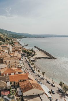 an aerial view of the beach and town