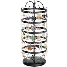 a jewelry rack with many pairs of earrings hanging from it's sides, on a black stand