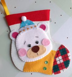 a christmas stocking with a bear wearing a hat