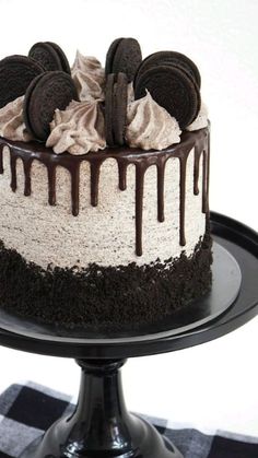 a cake with oreo cookies and cream on top