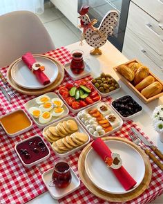 the table is set with many different foods and condiments