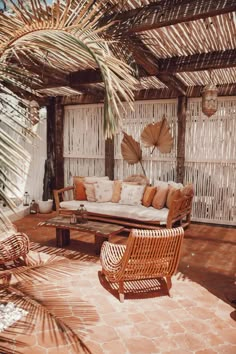 an instagram photo of a living room with wicker furniture and palm trees in the background