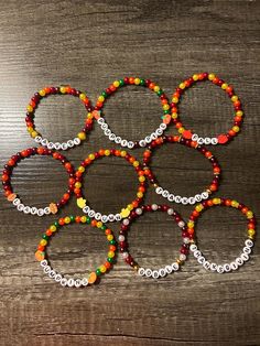 Homemade fall and Thanksgiving bracelets. Fun fall and Thanksgiving themed designs for anyone to enjoy. Friendsgiving Bracelets, Thanksgiving Friendship Bracelet, Thanksgiving Beaded Bracelets, Thanksgiving Bracelet Ideas, Thanksgiving Bead Bracelet, Thanksgiving Amigurumi, Fall Bracelet Ideas, Thanksgiving Bracelet, Holiday Bracelet