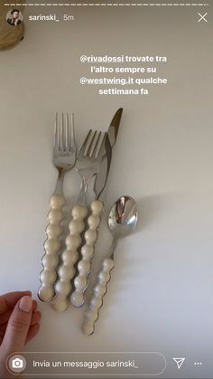 there is a fork, spoon and knife on the table