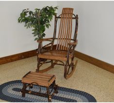 a rocking chair and footstool in a room with a rug on the floor