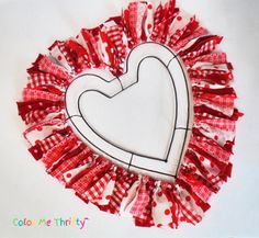 a red and white heart made out of fabric