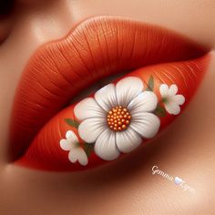 an orange lip with white flowers painted on it