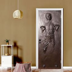 a door with an image of a basketball player painted on it and a basket next to it