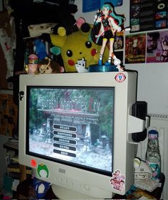 a computer monitor sitting on top of a desk