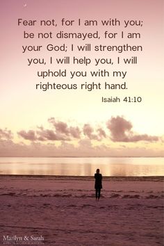 a man standing on top of a beach next to the ocean with a bible verse