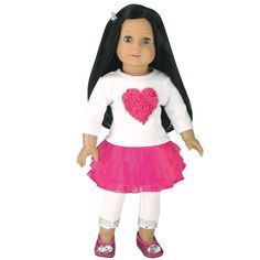 a doll with long hair wearing a white shirt and pink skirt is standing in front of a white background