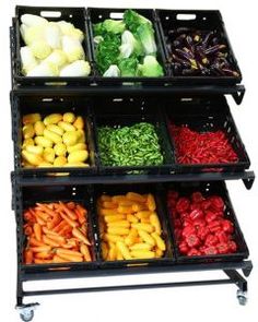 an assortment of fruits and vegetables are arranged in bins on a metal rack with wheels