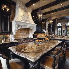 a large kitchen with marble counter tops and black cabinets