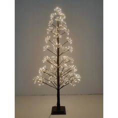 a lighted christmas tree with white lights on it