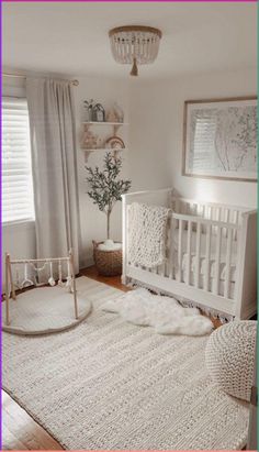 a baby's room with a white crib and rug