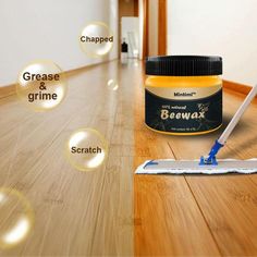 a close up of a paint brush on a wooden floor next to a bottle of bewax