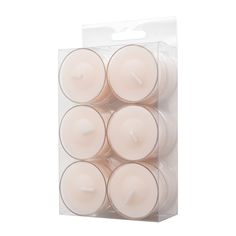 six white candles in a clear box