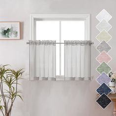 a living room with white walls and curtains on the window sill next to a potted plant