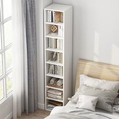 a bedroom with a bed, bookshelf and window in the corner next to it